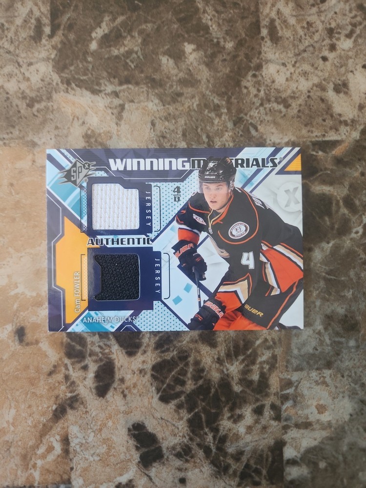 2013-14 NHL SPX Cam Fowler Winning Materials Dual Jersey Card #WM-CF