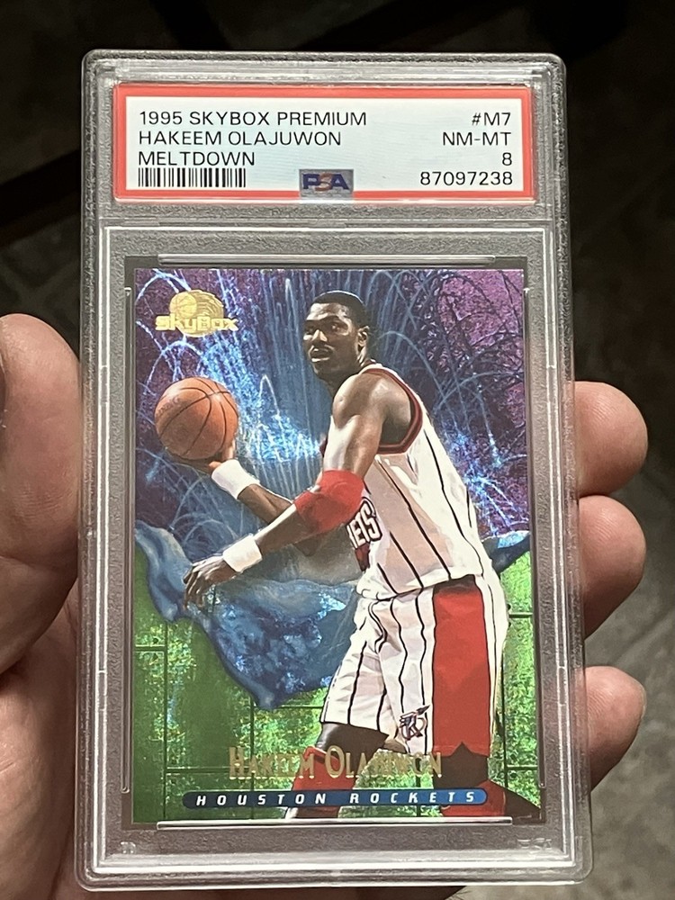 1995-96 Skybox Premium – Meltdown Hakeem Olajuwon #M7 PSA 8 Rockets Legend HOF