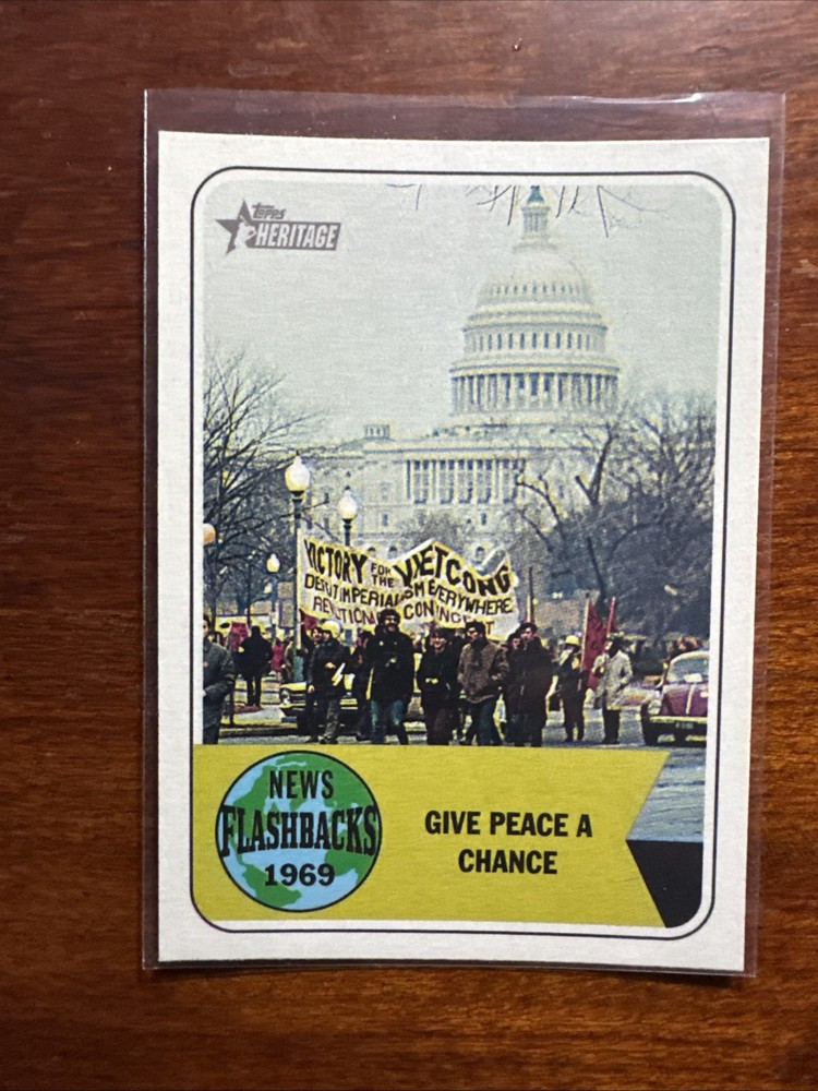 2018 Topps #NF-13 News Flashbacks Give Peace a Chance Vietnam War Protest MC1