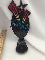 7 3/4&Prime; Tall – Black Plastic Background With Colored Star Bursts Trophy Toppers