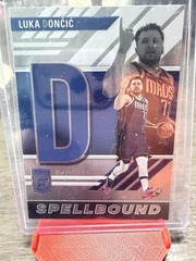 2023-24 Panini Elite Luka Doncic Spellbound ‘D’ Insert #28 Mavericks