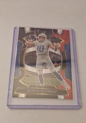 2025 Panini Select – Concourse Justin Herbert #1 Black & Red Shock Prizm