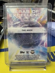 The Rock 2026 Topps Chrome WWE #ERA-12 Blue Refractor Eras of Excellence /150