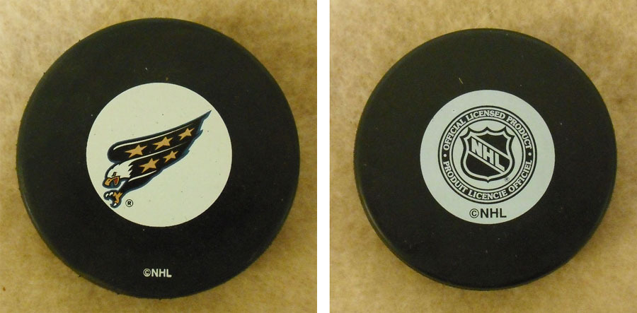 LOT OF 2 HOCKEY PUCKS -NHL OFFICIAL IN GLAS CO – WASHINGTON CAPITALS -FREE SHIP