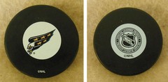 LOT OF 2 HOCKEY PUCKS -NHL OFFICIAL IN GLAS CO – WASHINGTON CAPITALS -FREE SHIP