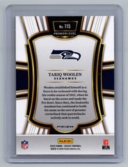 2025 Panini Select Tariq Woolen #115 Premier Level Black and Orange Prizm Shock