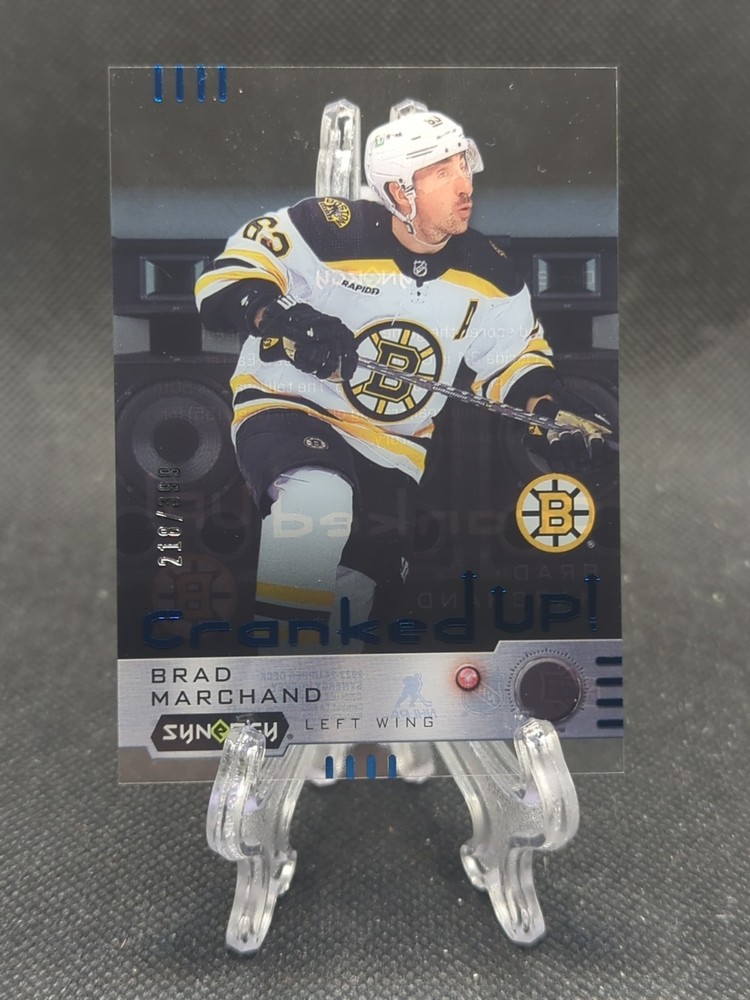 2023-24 UD Synergy Cranked Up Blue /399 Brad Marchand #CR-BM Boston Bruins