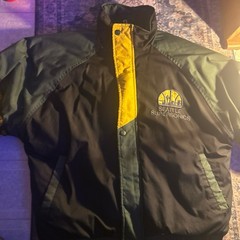Black, green, and yellow 90’s vintage NBA Supersonics bomber jacket