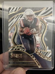 2023 Panini Select – Club Level Rhamondre Stevenson #223 Zebra Prizm Die-Cut