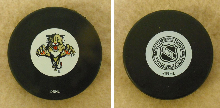 LOT OF 2 HOCKEY PUCKS -NHL OFFICIAL IN GLAS CO – FLORIDA PANTHERS – FREE SHIP